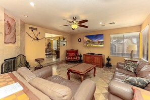 Spacious and inviting living room with cozy leather seating.