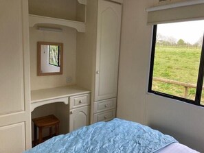 Wardrobes and dressing table in double bedroom