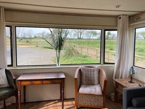 Sitting room with views of the paddocks and horses