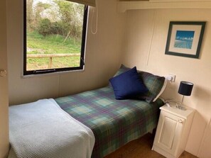 Single bedroom with wardrobe and bedside table