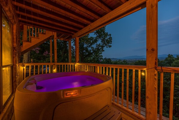 Hot tub on one of the 2 decks, overlooking a wide amazing mountain view. 