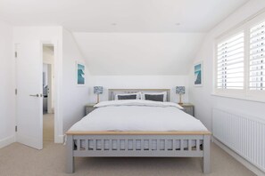 The master bedroom, featuring a super king bed, is located on the first floor.