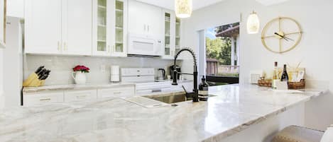 Exquisite quartz countertop, exuding coastal vibes.