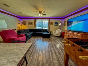 Game Room with 75 inch 4K TV concert surround sound