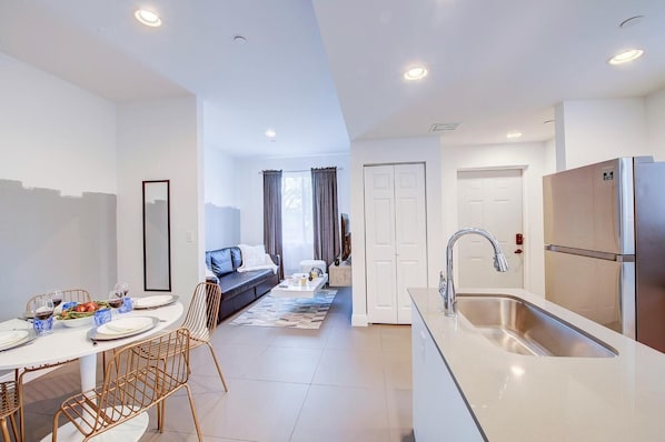 Dining room in front of the kitchen. Living room and laundry room to the back. 