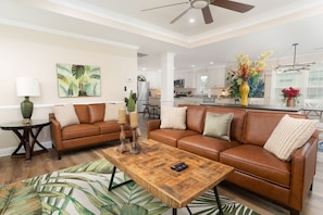 Large 70" Smart TV with plenty of seating space fills the living room