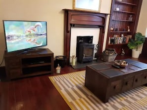 Living Room with Smart TV and wood burner 
