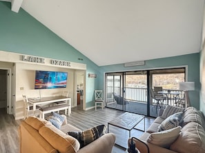 Open living area with comfortable seating and lake views