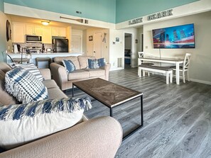 Living, dining and kitchen area open to natural light