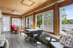 Enjoy your vacation, both indoors and out with a delightful sunroom - perfect for enjoying your morning coffee, reading on a rainy day, or dining out of the elements.