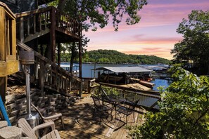 Enchanting deck views with the perfect space for lounging, watching sunsets, or dining while looking over the lake!