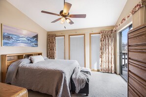 Master bedroom with lake view and deck access