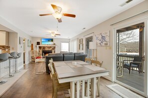 Open Living & Dining Area with Lake Facing Screened Porch