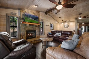 The stone fireplace at Huskey Hill Lodge is perfect for cozy nights.