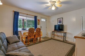 Open living space featuring a Roku streaming TV