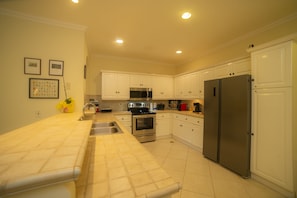 Kitchen is fully equipped. Includes oven, dishwasher, coffee machine, rice maker, everything you'll need.