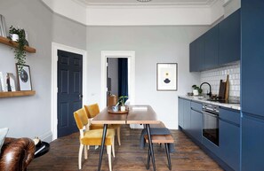 Flat 2 open-concept kitchen and dining space.