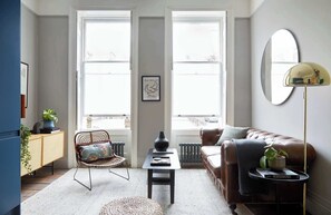 Flat 2 light-filled living area with a modern aesthetic.