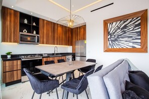 The condo has full kitchen with oven, stove, dishwasher and microwave
