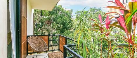 Enjoy jungle views from your private 3rd floor balcony