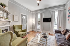 The living room features a sleeper sofa and a ROKU Smart TV.