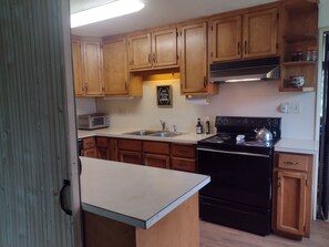 Kitchen with sliding wall in the foreground