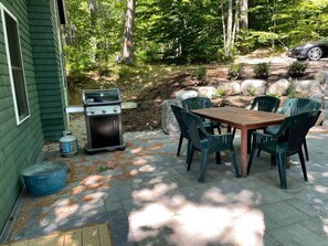 Stone patio on street side of house