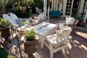 Gorgeous sitting area with gas firepit. Full view of the beautiful yard.