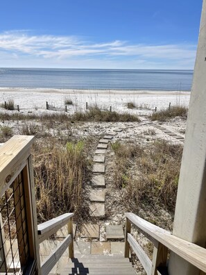 Step right onto Mexico Beach's clean white quartz sand beach from the carport. 