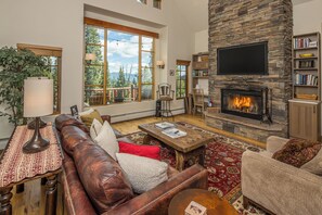 The views from the living room will have you looking outside instead of at the tv | Main Level