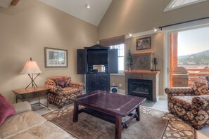 The living room is the perfect place to gather for a movie night | Main Level