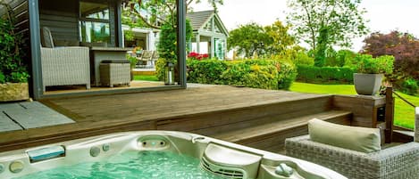 Hot tub area by Summer House and outdoor seating terrace