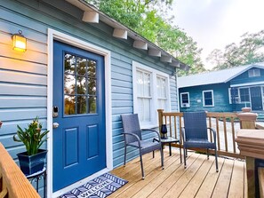 Two chairs and one table on the porch for you to lounge.
