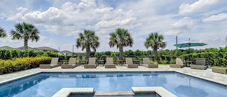 Pool View with Sunbathing Chairs