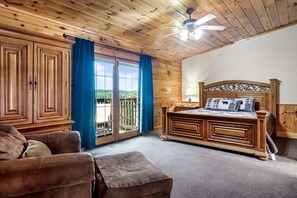 A bedroom that feels like a hug! With fresh linens and a comfy bed against a rustic wooden wall, it’s the ultimate escape.