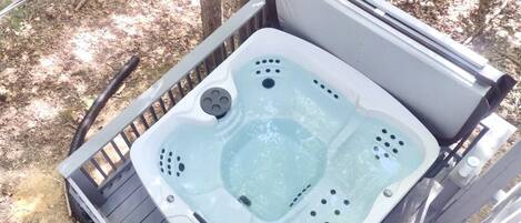 Our NEW hot tub is located on the lower deck and perfect for relaxing in nature!
