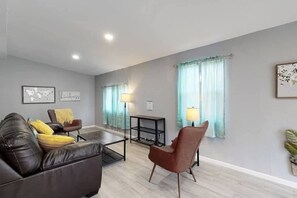 Guests will enter the unit through the secure/private back door. The bright. garden level sunroom is a great place to relax and mingle with your family. The kitchen, bedrooms, and bathroom are just down the stairs 