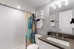 Updated bathroom with modern custom tile. 
