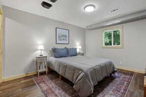 Lower level bedroom with queen bed