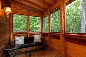 Listen to the sounds of nature while lounging on the Screened in Porch