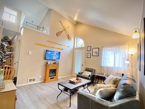 Light, airy and bright living room w/ private balcony. New flooring throughout