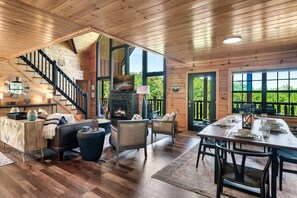 Main level open floor plan with deck across the back of the house