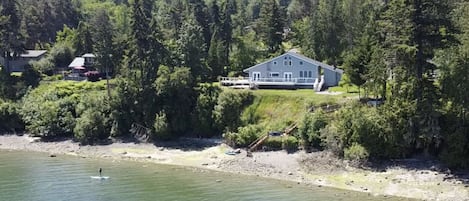 This magical house on Sequim Bay has 160' of private waterfront & tideland