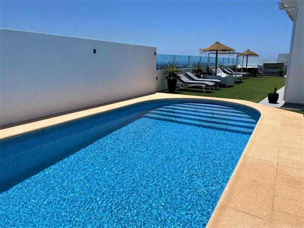 Lovely sea view with a heated pool + free air con with cool and heat  