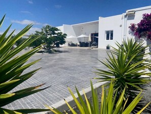 Lovely sunny front and rear patios