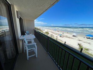 balcony with direct beach front view and  furniture