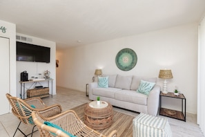Beautiful living space with full size sleeper sofa and flat screen TV to enjoy