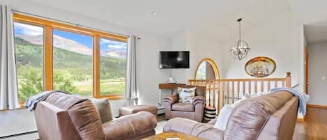 Living room: Smart TV, electric heating, no A/C