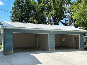 4-car garage with 1 assigned parking space for each rental unit labeled 1,2,3,4.