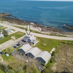 aerial view of "Snug Harbor", across the street from the ocean, large lawn area to relax, sunbath, and walking distance to Wallis Sands